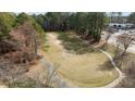 An open sports field is surrounded by tall trees with a walking path and soccer goals at 8311 Yaxley Hall Dr, Raleigh, NC 27616