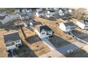 Aerial view of a suburban home with a spacious backyard and a well-manicured lawn in a friendly neighborhood at 95 Westbrook Ln, Franklinton, NC 27525