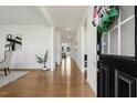 Inviting foyer with hardwood floors and view to the open living space with its neutral walls, enhancing the home's bright feel at 143 Rossell Park Cir, Garner, NC 27529