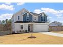 Charming two-story home with a two-car garage, well-manicured lawn and lovely curb appeal at 171 Piney Field Rd, Fuquay Varina, NC 27526