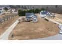 Spacious property with manicured lawn and long driveway, providing ample parking at 23 Sparkle Ln, Garner, NC 27529
