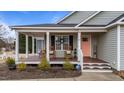 Inviting front porch with rocking chairs, perfect for relaxing and enjoying the outdoors at 23 Sparkle Ln, Garner, NC 27529