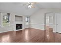 Bright living room with hardwood floors, fireplace, neutral walls, vaulted ceilings and lots of natural light at 23 Sparkle Ln, Garner, NC 27529