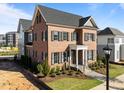 Beautiful brick home with dark shutters, manicured landscaping, and a welcoming front entrance at 2623 Marchmont St, Raleigh, NC 27608