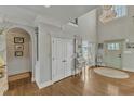 Elegant foyer featuring hardwood floors, decorative millwork, and a chandelier, creating a welcoming entrance at 296 Shoreline Dr, Princeton, NC 27569