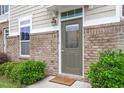 Inviting front door with a 'Welcome' mat and manicured landscaping enhancing curb appeal at 510 Berry Chase Way, Cary, NC 27519