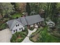 A beautiful single story home is captured from above and features professionally landscaped front yard at 515 S Woodland Rd, Henderson, NC 27536