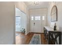 Bright foyer with hardwood floors, stylish console table, and a front door with sidelights at 6236 Annabella Rd, Rocky Mount, NC 27803