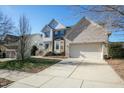Attractive two-story home featuring a brick and siding exterior, complemented by a well-maintained lawn and driveway at 708 Barley Green St, Wake Forest, NC 27587