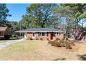 Attractive single-story brick home features a well-manicured lawn and traditional architectural style at 1216 York St, Rocky Mount, NC 27803