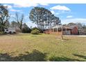 Large backyard featuring a spacious carport and a storage shed at 200 Arlington Cir Cir, Sanford, NC 27330