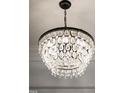 Close-up view of an ornate chandelier, adding a touch of elegance to the home at 207 Linden Ave, Raleigh, NC 27601