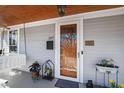 Charming front porch featuring a swing and lovely potted plants, creating a warm, inviting space at 207 Linden Ave, Raleigh, NC 27601