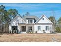 Beautifully built single-Gathering home with a well-manicured lawn and established trees at 2412 Toll Mill Ct, Raleigh, NC 27606