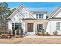 Charming home featuring a symmetrical facade and covered front porch at 2412 Toll Mill Ct, Raleigh, NC 27606