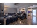 Comfortable living room featuring a large sectional sofa, hardwood floors, and an open layout at 2518 Pilot Riley Rd, Zebulon, NC 27597