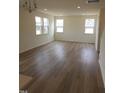 Bright, spacious living room with hardwood floors and large windows at 28 Longdale Dr, Graham, NC 27253