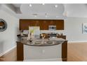 Kitchen island with granite countertop, stainless steel sink and faucet, with open floorplan at 301 Fayetteville St # 3205, Raleigh, NC 27601