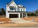 New construction home featuring a white exterior, attached garage, and inviting front porch at 3213 Emeline Way # 14, Fuquay Varina, NC 27526