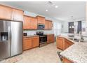 Bright kitchen featuring stainless steel appliances and granite countertops at 4508 Brintons Cottage St, Raleigh, NC 27616