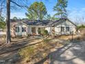 Inviting single-story home with mature trees and landscaping in a peaceful, residential setting at 573 Broadmoor Ct, Sanford, NC 27332