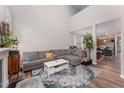 Spacious living room with soaring ceiling that flows into dining and kitchen at 702 Great Eno Path, Hillsborough, NC 27278