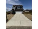 New construction home with a large driveway and attached two-car garage, perfect for families at 104 Whistling Way # Brunswick English Country, Lillington, NC 27546