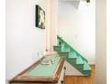 Bright stairway with custom painted risers and wood flooring in a modern home at 105 Fidelity St # B24, Carrboro, NC 27510