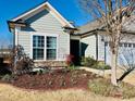 Attractive home with a well-maintained front yard and garden at 111 Kalmia Dr, Durham, NC 27703
