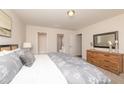 Serene main bedroom with neutral tones, a spacious layout, and an ensuite bathroom for added privacy at 114 Johnson Ridge Way, Four Oaks, NC 27524