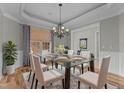 Elegant dining room featuring stylish chandelier and ample seating for formal meals at 1208 Anora Dr, Apex, NC 27502