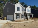 Two-story home featuring gray siding, a two-car garage, and a walkway to the front door at 1803 Ballard Rd # Holly Craftsman, Fuquay Varina, NC 27526