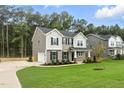 Beautiful two-story home with a two car garage, landscaped front yard and well manicured lawn at 1803 Ballard Rd # Holly Craftsman, Fuquay Varina, NC 27526