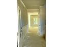 Bright hallway showcases paneled walls and leads to additional rooms within the home at 1803 Ballard Rd # Holly Craftsman, Fuquay Varina, NC 27526