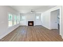 Bright living room features fireplace, built-in cabinets, and large windows at 1803 Ballard Rd # Holly Craftsman, Fuquay Varina, NC 27526