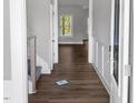 Inviting entryway with hard surface floors, white trim, and natural light at 1849 Ballard Rd # Holly Georgian, Fuquay Varina, NC 27526