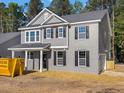 Two-story home featuring gray brick, siding, black shutters, and an attached garage at 1849 Ballard Rd # Holly Georgian, Fuquay Varina, NC 27526