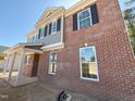 New brick home with black shutters and light gray siding at 1849 Ballard Rd # Holly Georgian, Fuquay Varina, NC 27526