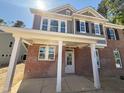 Brick front porch of the new home featuring classic white pillars at 1849 Ballard Rd # Holly Georgian, Fuquay Varina, NC 27526