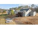 The backyard features a screened in deck and a fire pit providing an ideal outdoor entertaining and relaxation space at 40 Cinnamon Teal Way, Youngsville, NC 27596