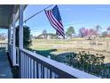 Enjoy a relaxing view of the expansive yard from the cozy front porch at 105 Glasgow Dr, Clayton, NC 27520
