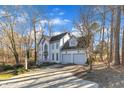 Beautiful two-story house featuring an attached two-car garage and a spacious driveway at 14 Wedgewood Pl, Clayton, NC 27527