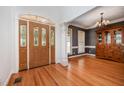 Welcoming foyer with hardwood floors, intricate trim work and a beautiful front door at 155 Georgetown Woods Dr, Youngsville, NC 27596