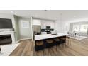 Modern kitchen with stainless steel appliances, an island with bar seating, and breakfast nook at 1903 Plott Balsam Dr, Wendell, NC 27591