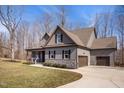 A well-maintained home showcases a manicured lawn, attached garage, and neutral gray color scheme at 193 Jenny Ln, Timberlake, NC 27583