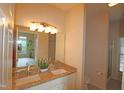 Bathroom features a double sink vanity with granite countertop and a well-lit mirror, combining style and functionality at 2520 Friedland # 202, Raleigh, NC 27617