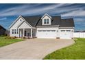 Lovely two-story home featuring a three-car garage and well-maintained lawn at 40 Thunder Valley Ct, Lillington, NC 27546