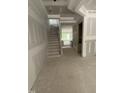 A view of the unfinished foyer showcasing the stairway and lighting at 60 Valebrook Ct, Youngsville, NC 27596