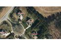 An aerial view shows the property and surrounding neighborhood at 690 Hawthorne Pl, Creedmoor, NC 27522