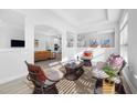 Bright living room with ample seating, modern decor, and open floor plan at 720 Shell Bank Ct, Cary, NC 27519